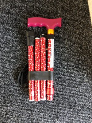 Adjustable walking stick with red pattern