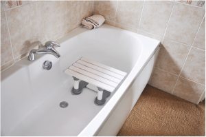 Slatted bath seat located in bath