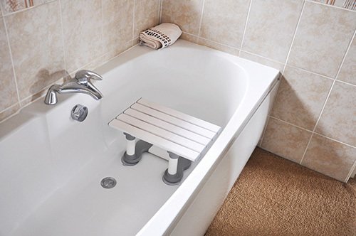 Seat in a bathroom optimized for people with mobility difficulties Bathing & Home Care