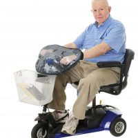 Older man sitting on scooter