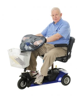 Older man sitting on scooter